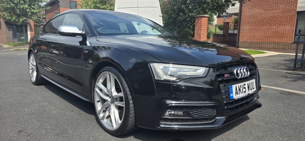 Black Audi S5 parked in residential area, showcasing polished exterior and alloy wheels, representing Rinse Works Mobile Valeting's Stage 1 Paint Correction service.